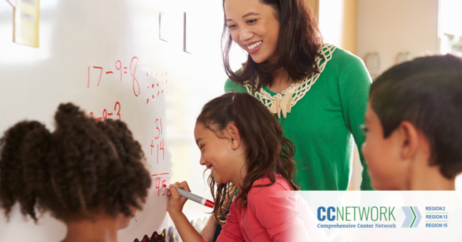 Young students learning math with teacher in classroom